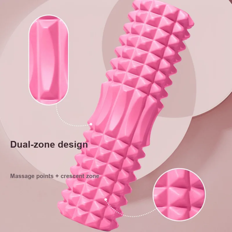 Pink foam roller with dual-zone massage points and crescent texture detail